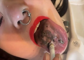 Asian human ashtray slave cigarette burned tongue
